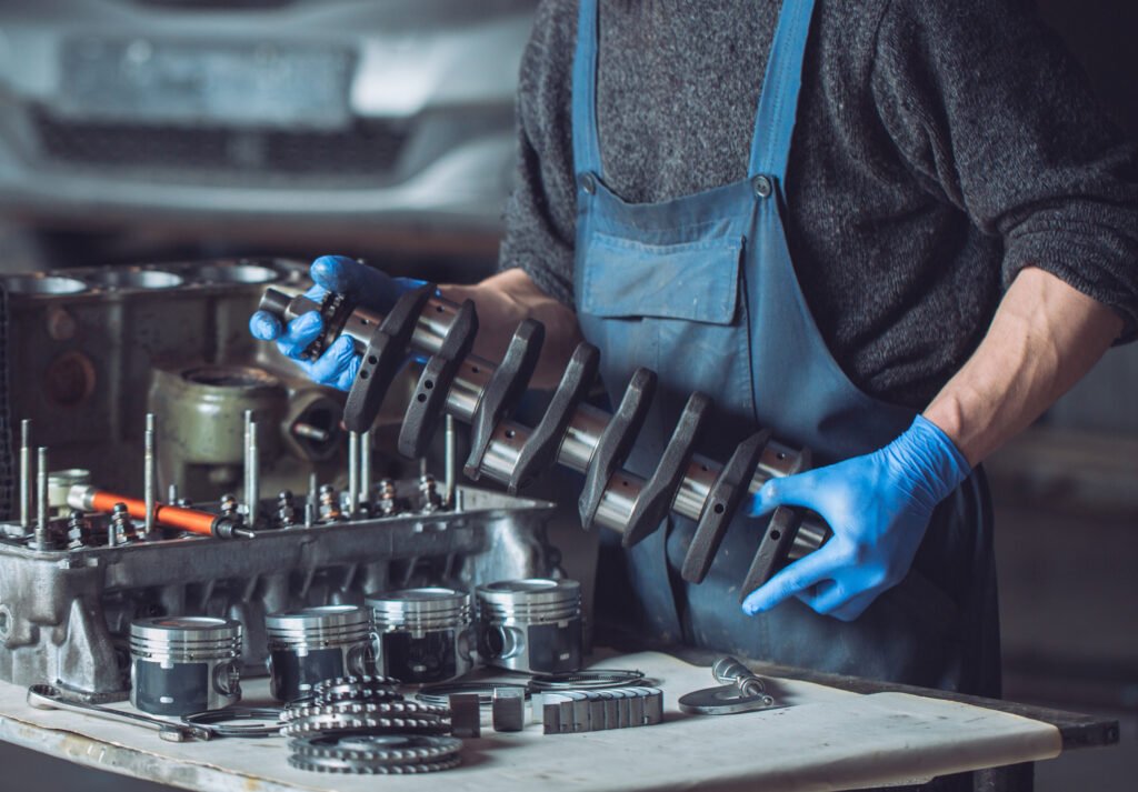 man holding a car part